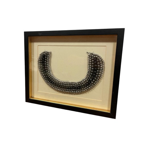 72 - A VINTAGE EBONISED WRITING TABLE the superstructure with hinged compartment above a rexine writing s... 