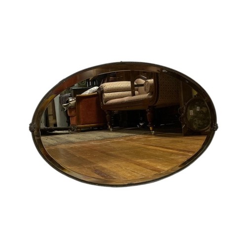 35 - A PINE PAINTED MONK'S BENCH the rectangular panel back above a hinged seat with loose cushion and sh... 