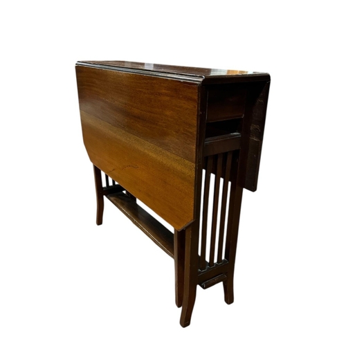 323 - A VINTAGE MAHOGANY SUTHERLAND TABLE the rectangular hinged top on splayed legs joined by pierced ver... 