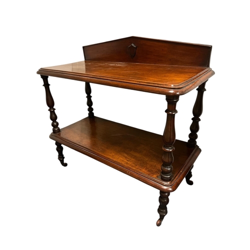 475 - A 19TH CENTURY MAHOGANY TWO TIER SIDE TABLE of rectangular outline with moulded back raised on balus... 