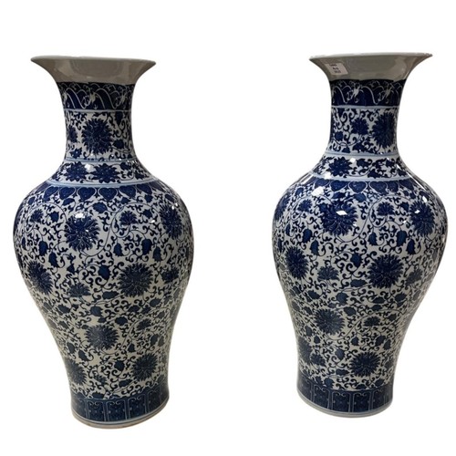 198 - A LARGE PAIR OF ORIENTAL BLUE AND WHITE VASES each of ovoid tapering form the white ground decorated... 