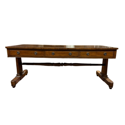 285 - A REGENCY ROSEWOOD COFFEE TABLE of rectangular outline with rounded corners and three frieze drawers... 