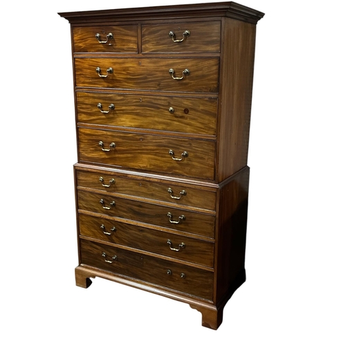 328 - A GEORGIAN MAHOGANY CHEST ON CHEST the moulded cornice above two short and three long graduated draw... 