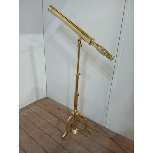 342 - A BRASS TABLE TOP TELESCOPE the telescopic column raised on a folding tripod support 110cm (h) x 70c... 
