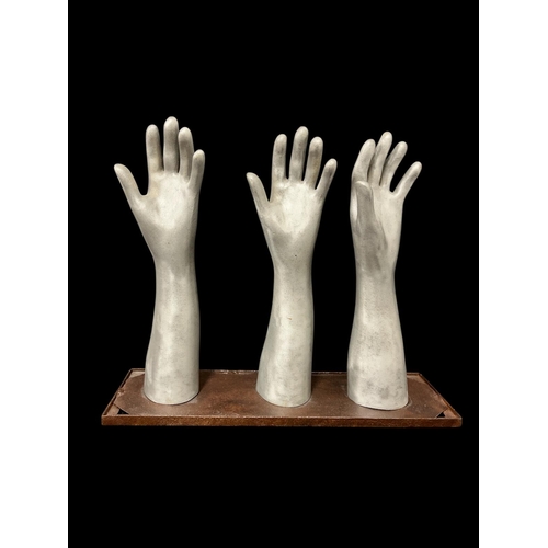 HANDS ALOFT Cast aluminium and mixed metals 40cm (h) x 50cm (w) x 15cm (d)