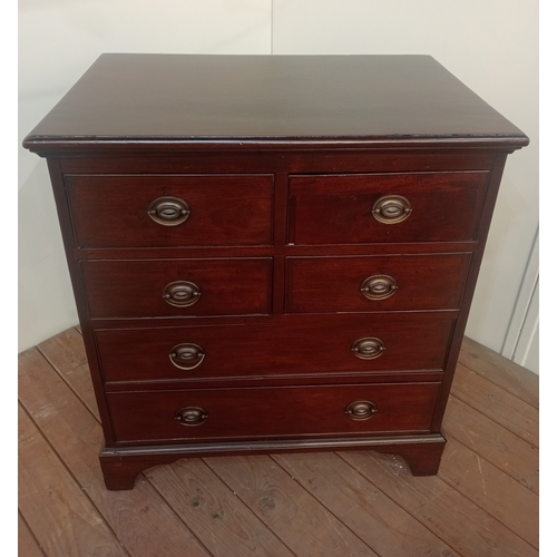 453 - A GEORGIAN STYLE MAHOGANY CHEST of rectangular outline the shaped top above four short and two long ... 