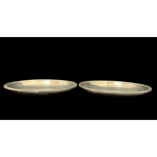A PAIR OF SILVER DISH LINERS each of oval outline with beadwork decoration Sheffield 1856, 30cm (h) x 23cm (w), 1398g total
