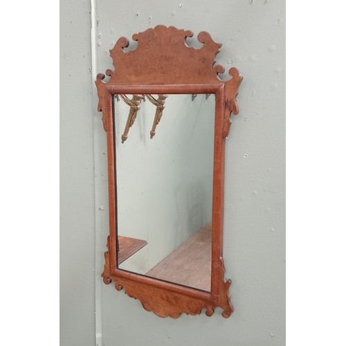 686 - A GEORGIAN STYLE WALNUT FRET FRAME MIRROR the rectangular plate within a shaped frame 68cm (h) x 36c... 