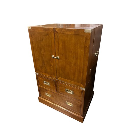 497 - A FINE WALNUT AND BRASS BOUND CAMPAIGN STYLE DRINKS CABINET of rectangular form the shaped top above... 