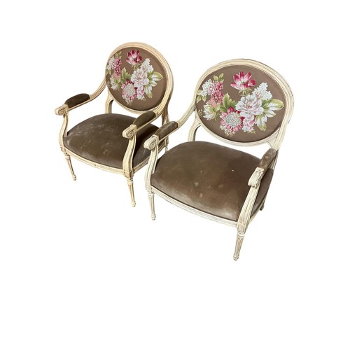 578 - A PAIR OF CONTINENTAL CREAM PAINTED AND UPHOLSTERED ARMCHAIRS each with an oval upholstered panel an... 
