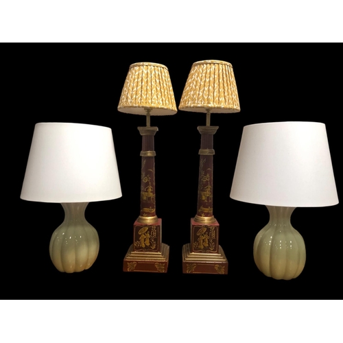 500 - TWO PAIRS OF TABLE LAMPS one pair of East Asian style with gold toned vignettes on a red background ... 