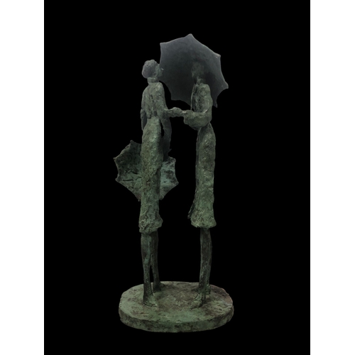 530 - JAMES MCCARTHY (1945 - 2019) A cast bronze group modelled as a female and her companion holding umbr... 