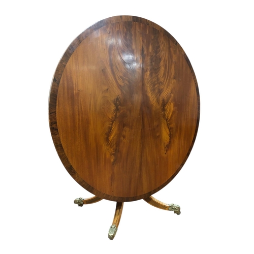 217 - A FINE GEORGIAN MAHOGANY AND ROSEWOOD CROSSBANDED POD TABLE the circular moulded top with gadrooned ... 