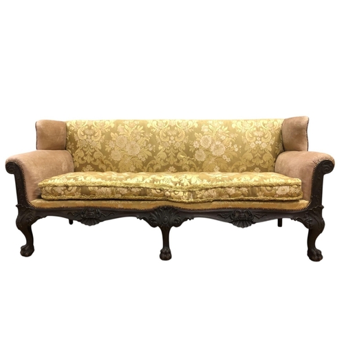 67 - A CHIPPENDALE STYLE MAHOGANY AND UPHOLSTERED WING BACK SETTEE the rectangular back and seat with loo... 