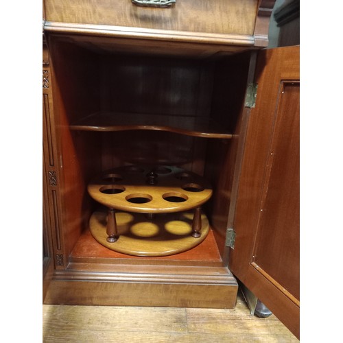 207 - AN EDWARDIAN SATIN BIRCH LIBRARY BOOKCASE the moulded cornice above three glazed doors containing ad... 
