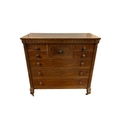A 19TH CENTURY MAHOGANY CHEST of rectangular outline the shaped top ...
