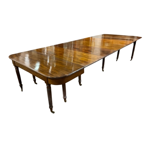 397 - A VERY FINE REGENCY MAHOGANY CONCERTINA ACTION EXTENDING DINING TABLE Cork c.1820, of rectangular fo... 