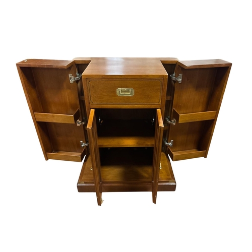 210 - AN ART DECO STYLE CHERRYWOOD AND BRASS BOUND CAMPAIGN STYLE DRINKS CABINET of rectangular outline th... 