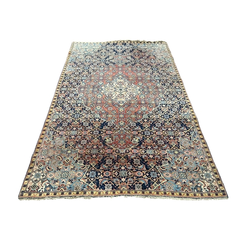 150 - AN ORIENTAL WOOL RUG the light blue, indigo and light pink ground with central panel filled with sty... 