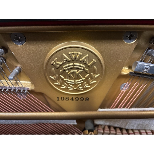 166 - A KAWAI BLACK LACQUERED CASED UPRIGHT PIANO steel frame, over string and under damper Serial No. 198... 