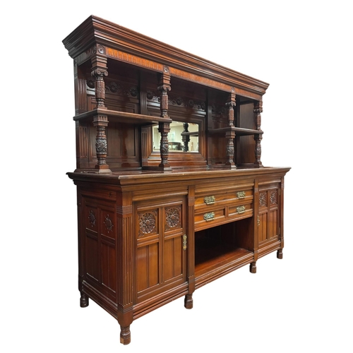 167 - A VERY FINE EDWARDIAN CARVED MAHOGANY SIDEBOARD the superstructure with moulded cornice above a cent... 