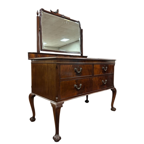 209 - A VINTAGE MAHOGANY DRESSING CHEST the superstructure with bevelled glass swivel mirror above two sho... 