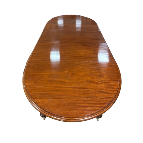 332 - A FINE 19TH CENTURY MAHOGANY TELESCOPIC DINING TABLE of rectangular outline with rounded ends and th... 