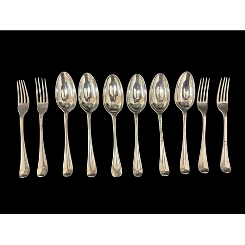 466 - A SET OF FOUR HANAY SILVER FORKS together with SIX HANAY SILVER SPOONS  732g (23.5 troy ozs.)
