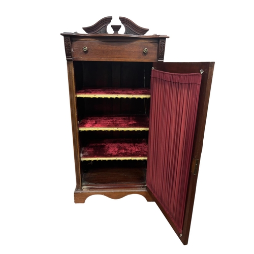 65 - AN EDWARDIAN MAHOGANY MUSIC STAND of serpentine outline the shaped top with carved and moulded three... 