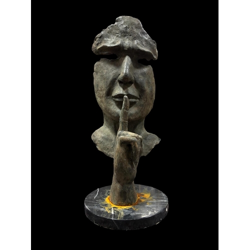 96 - after SALVADOR DALI A cast bronze sculpture 'The Silence' raised on a circular black veined marble b... 