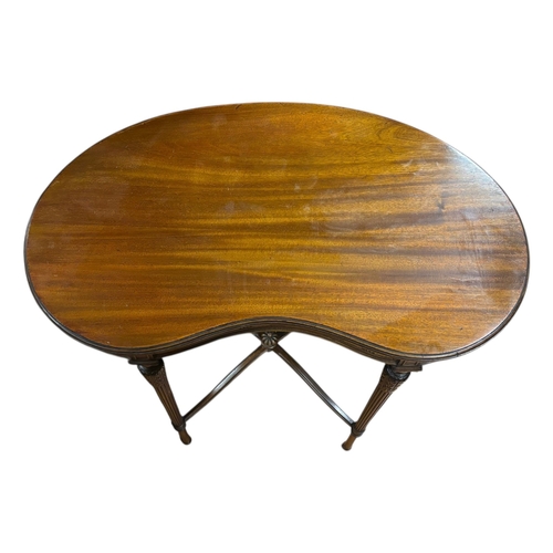 202 - A HEPPLEWHITE STYLE MAHOGANY OCCASIONAL TABLE of kidney shaped outline the shaped top raised on flut... 