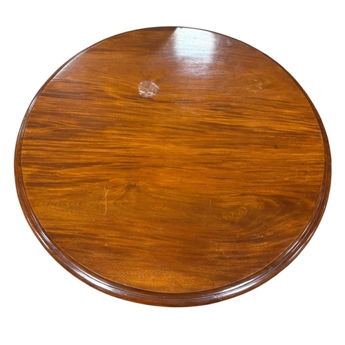 217 - A 19TH CENTURY MAHOGANY SNAP TOP POD TABLE the circular moulded top above a faceted column on platfo... 