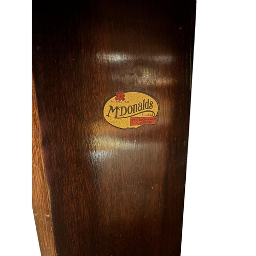 367 - A VINTAGE MAHOGANY REVOLVING TABLE the circular piecrust top above open compartments on a revolving ... 