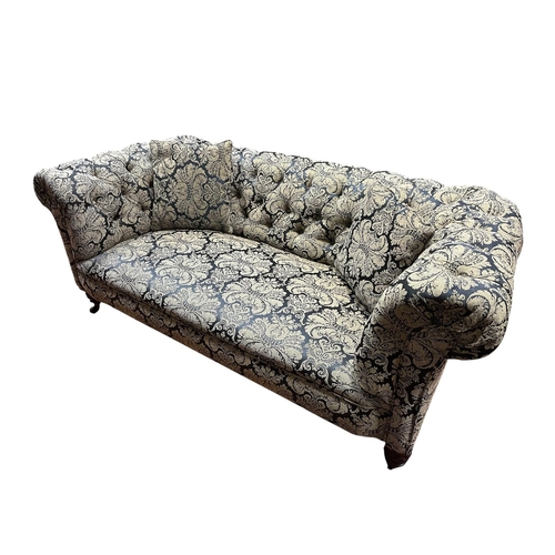 184 - A 19TH CENTURY MAHOGANY AND UPHOLSTERED SETTEE with deep buttoned upholstered scroll over back and a... 
