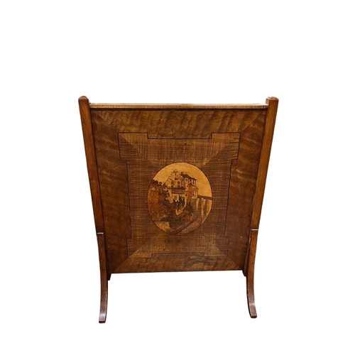 194 - A VINTAGE MAHOGANY INLAID FIRESCREEN of rectangular form inset with an oval inlaid panel on splayed ... 