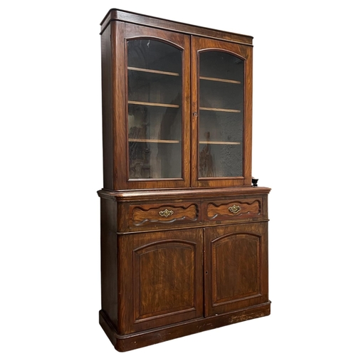203 - A 19TH CENTURY MAHOGANY LIBRARY BOOKCASE the moulded cornice above a pair of glazed doors containing... 