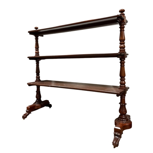 207 - A GOOD 19TH CENTURY THREE TIER DUMBWAITER each rectangular moulded shelf joined by baluster stretche... 