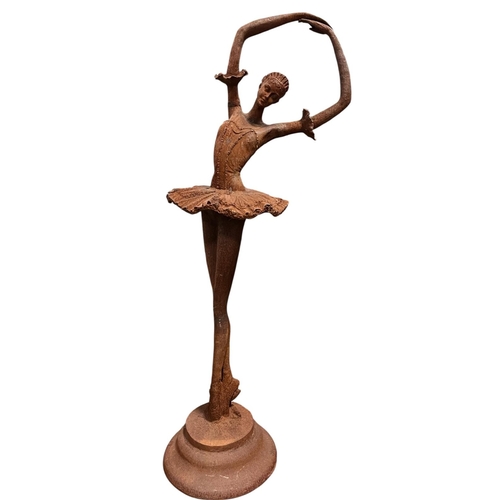 235 - A CAST IRON FIGURE modelled as a ballerina shown standing on a circular stepped platform 114cm (h) x... 