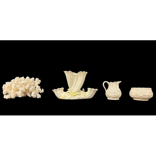 279 - THREE PIECES OF BELLEEK comprising a second period triple bud vase 12cm (h), a fourth period creamer... 