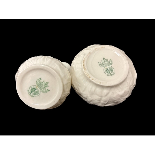 279 - THREE PIECES OF BELLEEK comprising a second period triple bud vase 12cm (h), a fourth period creamer... 