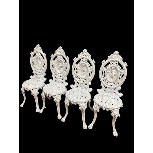 347 - A SET OF FOUR VICTORIAN STYLE CAST IRON PATIO CHAIRS each with an oval cameo back with pierced C-scr... 