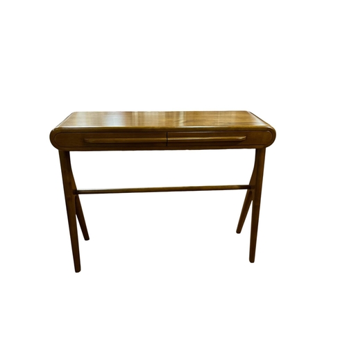 AN ART DECO STYLE CHERRYWOOD CONSOLE TABLE the rectangular shaped top with two frieze drawers on cylindrical spreading legs joined by a cross stretcher 81cm (h) x 103cm (w) x 33cm (d)
