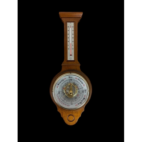 482 - A COLLECTION OF TWELVE SCENIC LITHOGRAPHS together with a vintage timber framed banjo barometer 56cm... 