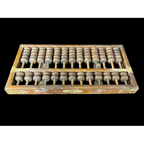 486 - A SELECTION OF CHINESE AND SOUTH EAST ASIAN ITEMS to include a brass banded wooden abacus Hong Kong ... 
