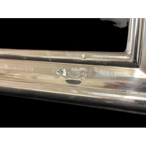 487 - SEVEN STERLING SILVER MOUNTED TABLE TOP PICTURE FRAMES Largest 30cm (h) x 24cm (w) together with a s... 