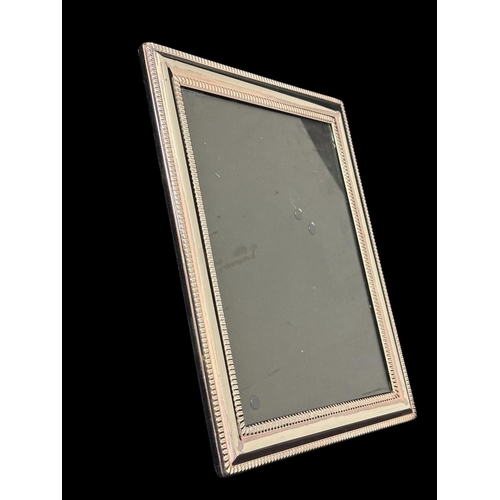 487 - SEVEN STERLING SILVER MOUNTED TABLE TOP PICTURE FRAMES Largest 30cm (h) x 24cm (w) together with a s... 