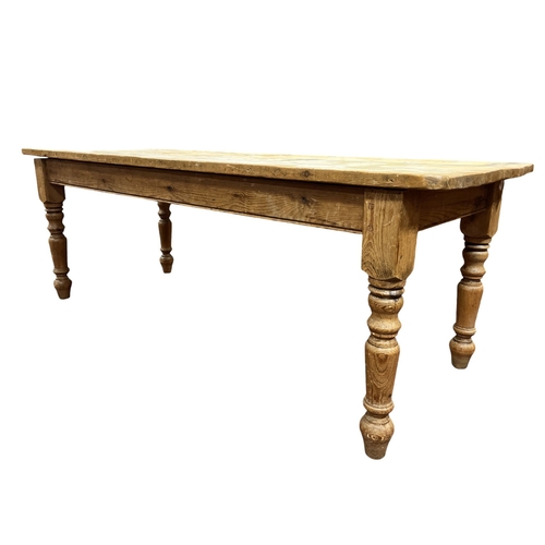 67 - ***WITHDRAWN*** A VICTORIAN STYLE PINE TABLE of rectangular outline the shaped top raised on baluste... 