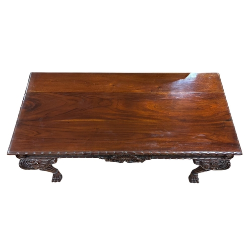 82 - A CHIPPENDALE STYLE MAHOGANY CONSOLE TABLE of rectangular outline the shaped top with glazed panel a... 