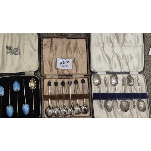 257 - A CASED SET OF SIX STERLING SILVER GILT ENAMEL BACKED SPOONS Maker's marks of Barker's Brothers Silv... 