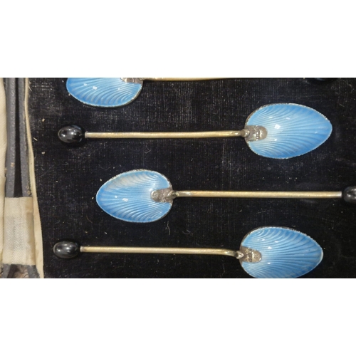 257 - A CASED SET OF SIX STERLING SILVER GILT ENAMEL BACKED SPOONS Maker's marks of Barker's Brothers Silv... 